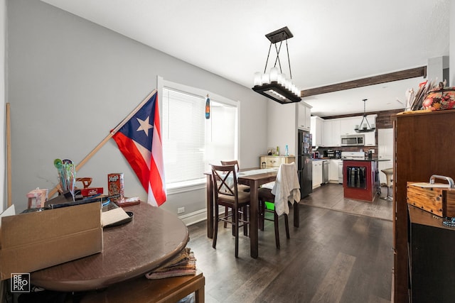 dining area featuring dark hardwood / wood-style flooring