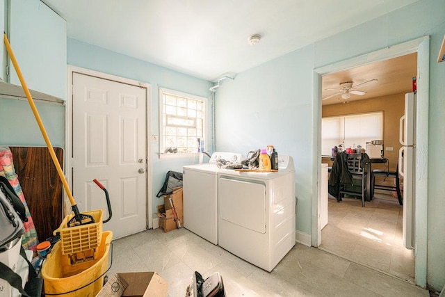 laundry area with light tile patterned flooring, washer and clothes dryer, and ceiling fan