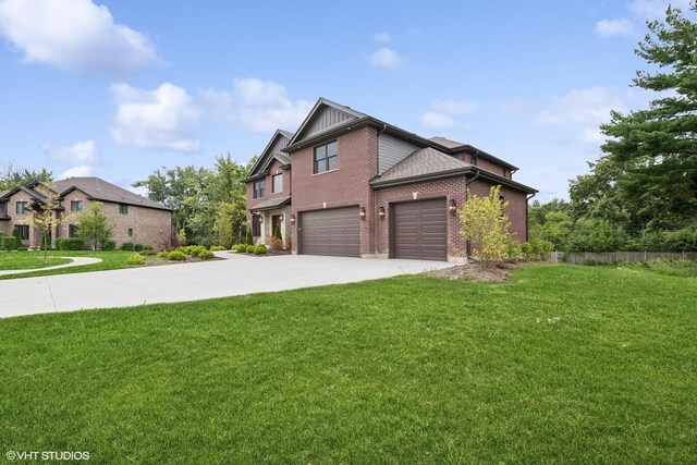 view of front of home featuring a garage and a front yard