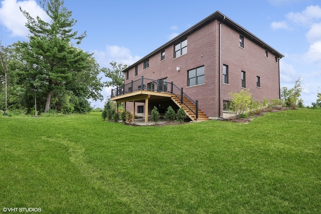 back of house with a wooden deck and a lawn