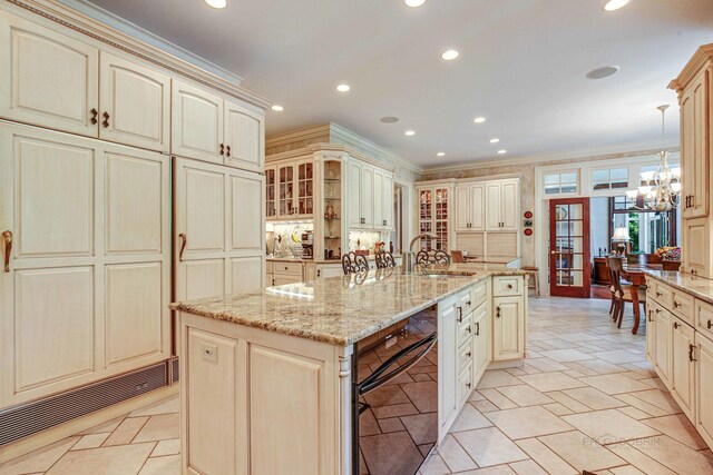 546 Lakeland Dr, Lake Bluff, IL 60044 - kitchen with cream cabinetry, a sink, recessed lighting, crown molding, and a chandelier