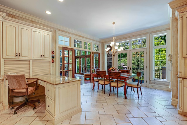 tiled dining area with crown molding, french doors, and a chandelier