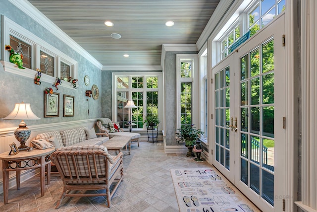 sunroom / solarium featuring french doors and wood ceiling