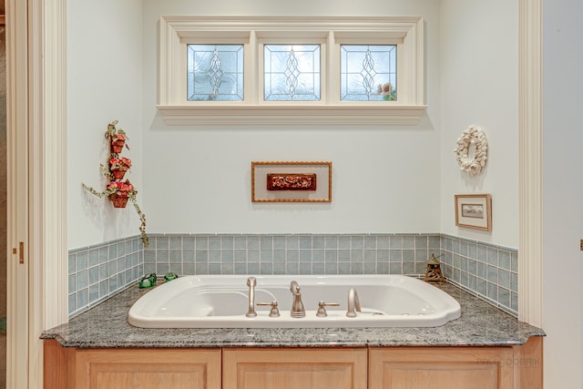 bathroom with a tub to relax in