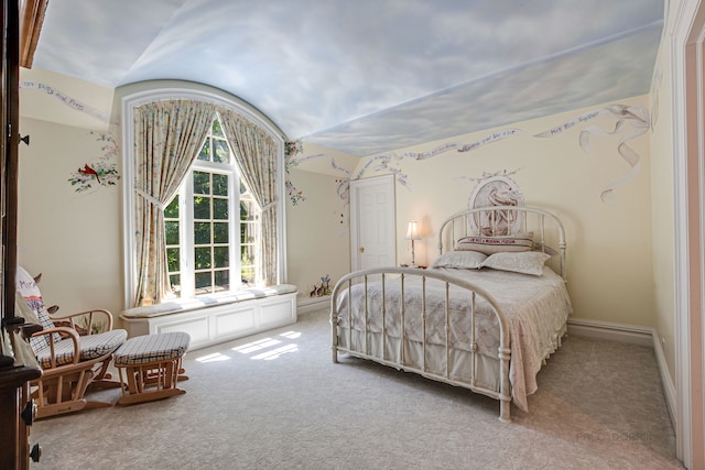 carpeted bedroom featuring vaulted ceiling