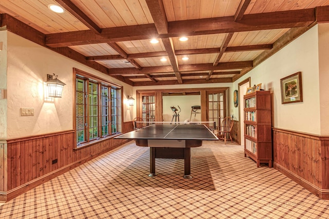 recreation room featuring beamed ceiling, french doors, coffered ceiling, and wooden ceiling