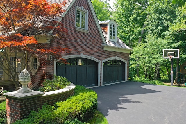 view of side of home with a garage