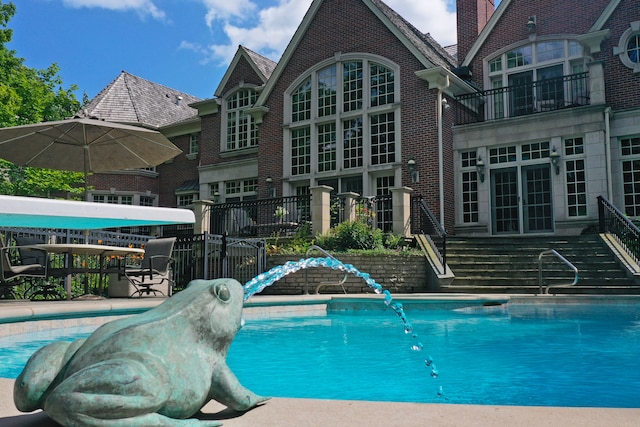 view of swimming pool featuring a water slide