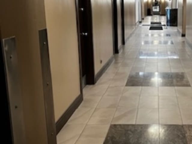 hallway with light tile patterned floors