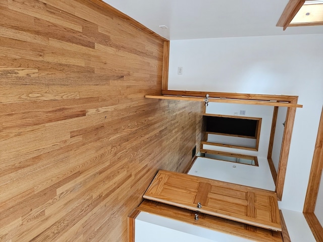 interior space featuring wooden walls