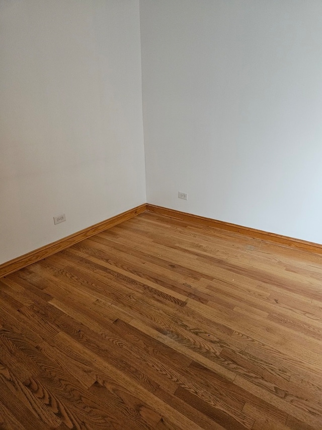 unfurnished room featuring dark hardwood / wood-style floors