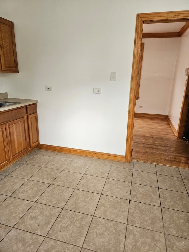 unfurnished dining area featuring light hardwood / wood-style flooring and sink