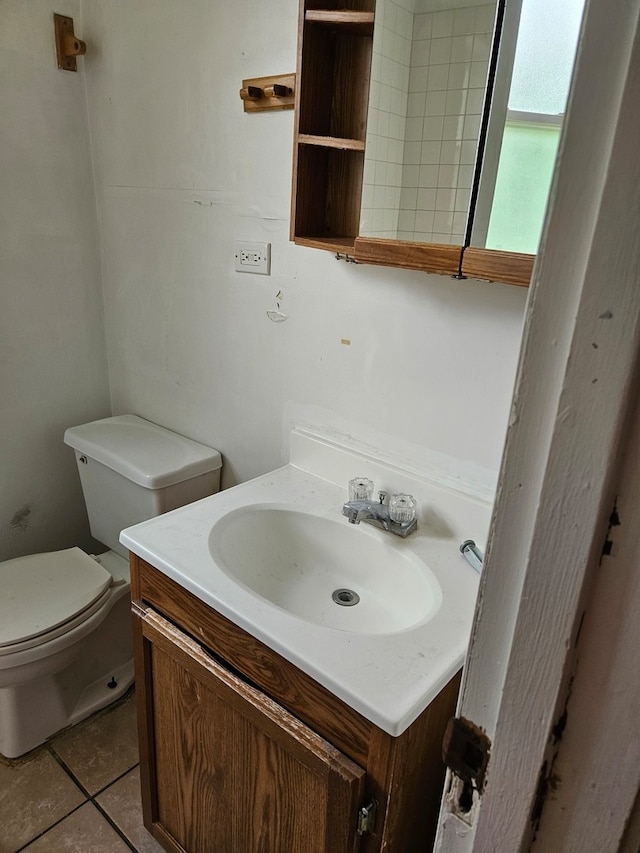 bathroom featuring vanity, toilet, and tile patterned floors