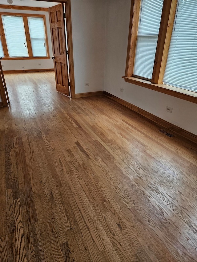 spare room featuring hardwood / wood-style floors