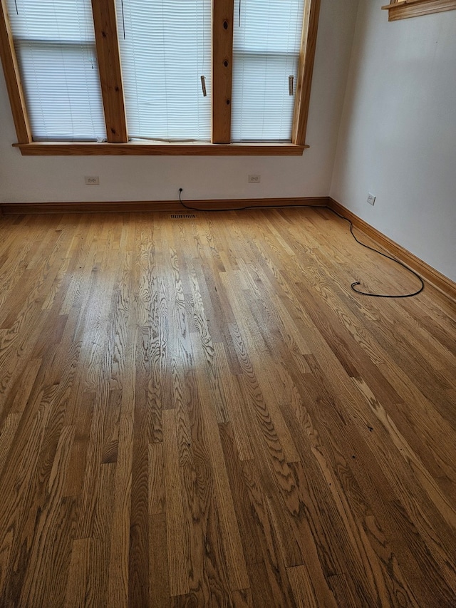 spare room featuring hardwood / wood-style flooring