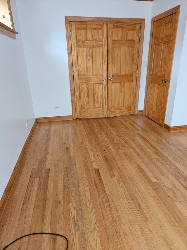 unfurnished bedroom with light hardwood / wood-style floors