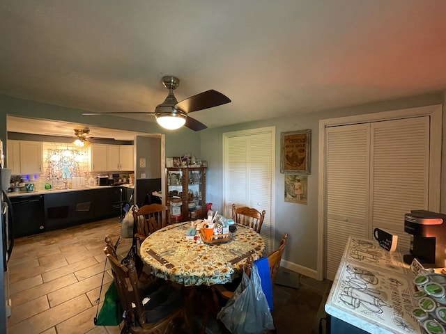 dining area featuring sink, ceiling fan, and light tile patterned floors