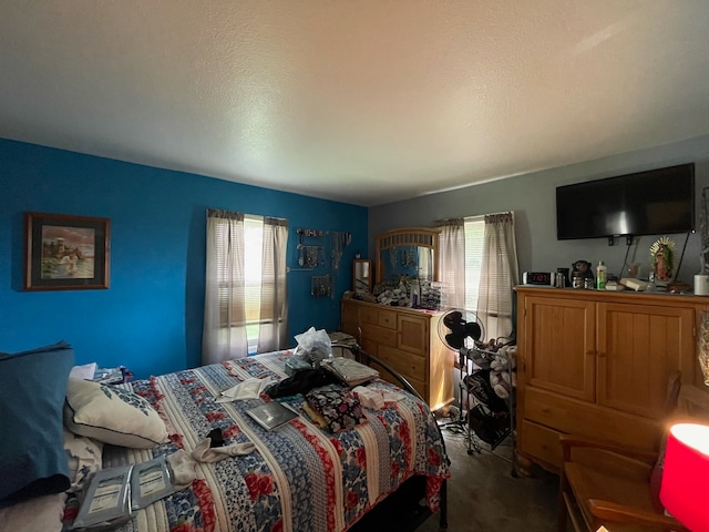 bedroom with carpet floors and multiple windows