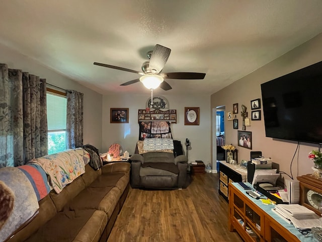 living room with wood-type flooring and ceiling fan