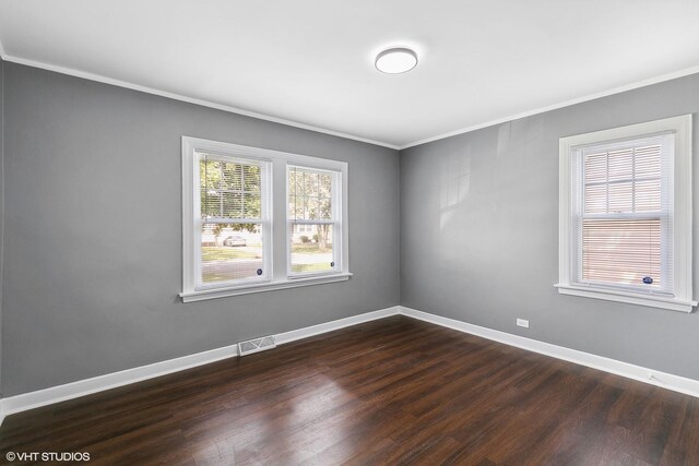 unfurnished room featuring hardwood / wood-style flooring and ornamental molding