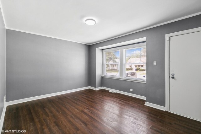 unfurnished room with crown molding and hardwood / wood-style flooring