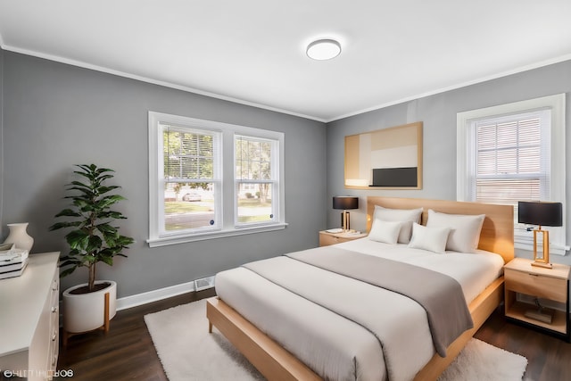 bedroom featuring dark hardwood / wood-style flooring and crown molding