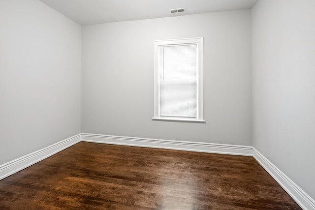 empty room featuring dark hardwood / wood-style floors