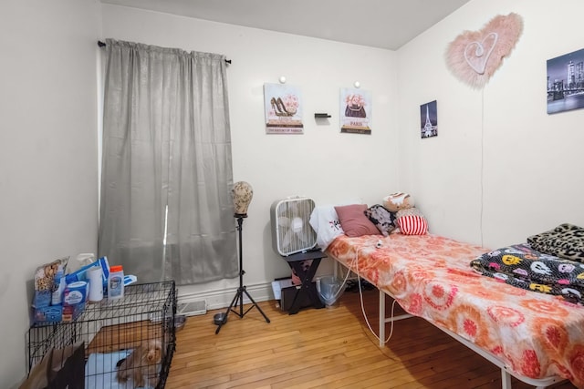 bedroom featuring hardwood / wood-style flooring