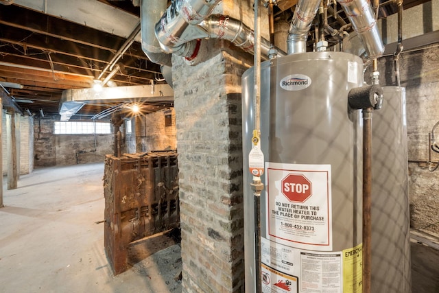 utility room with gas water heater