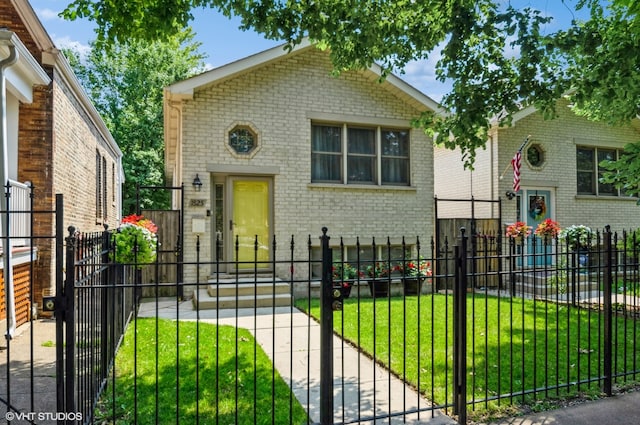 bi-level home with a front lawn