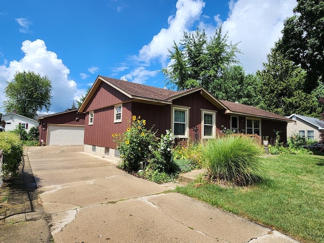 single story home featuring a garage and a front yard