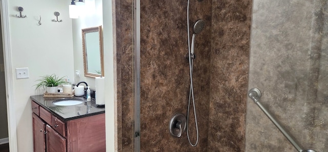 bathroom featuring a shower and vanity