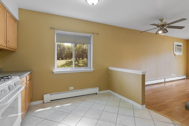 unfurnished dining area featuring a baseboard radiator, light tile patterned floors, ceiling fan, and a wall unit AC