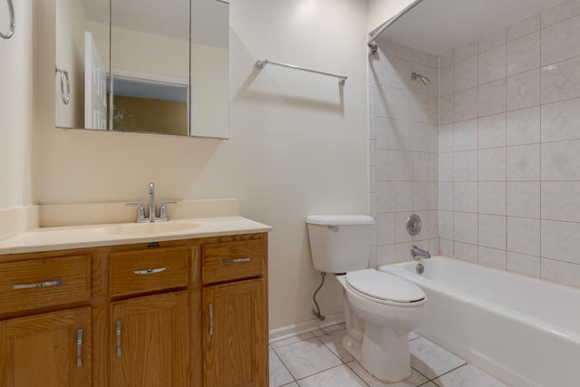 full bathroom featuring vanity, toilet, and tiled shower / bath combo