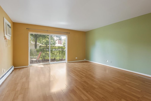 unfurnished room featuring a baseboard radiator and light wood-type flooring