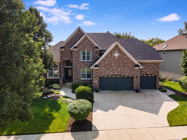 view of front facade with a garage and a front yard