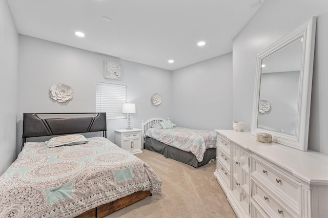 bedroom with recessed lighting and light colored carpet