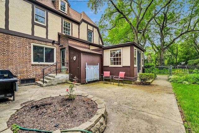 back of house with a patio