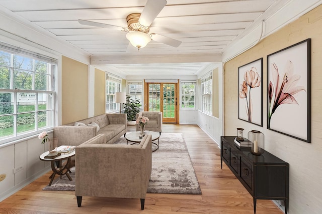 sunroom featuring ceiling fan