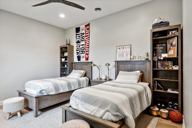 bedroom featuring hardwood / wood-style floors and ceiling fan