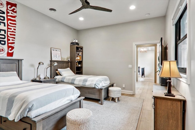 bedroom featuring light hardwood / wood-style flooring and ceiling fan