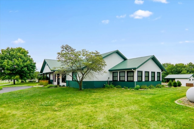 exterior space featuring a front lawn