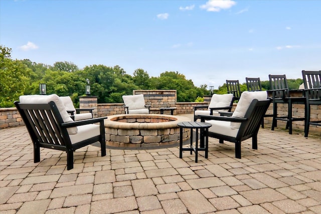 view of patio featuring an outdoor fire pit