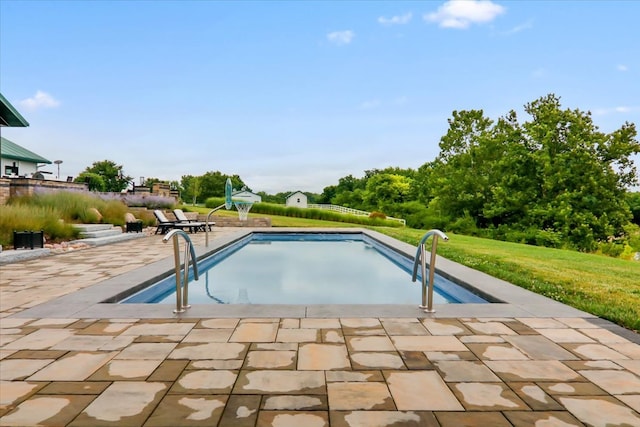 view of swimming pool featuring a patio