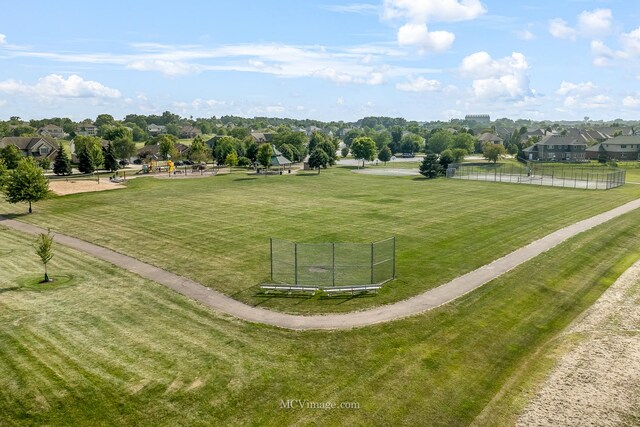 view of home's community with a yard