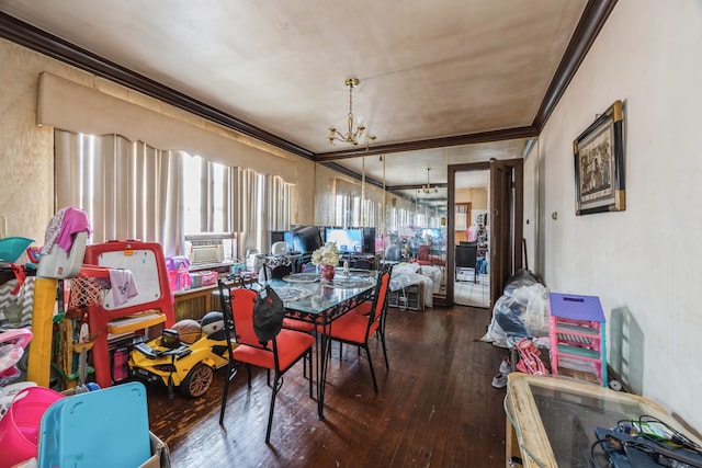 dining area featuring cooling unit, crown molding, a chandelier, and wood-type flooring