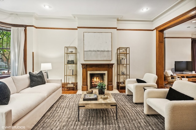 living room with ornamental molding and hardwood / wood-style flooring