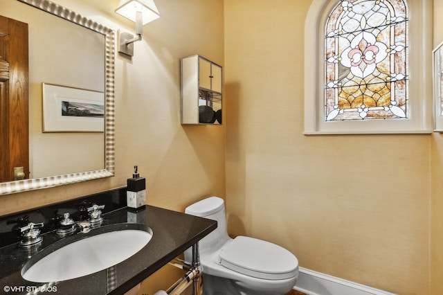 bathroom with vanity and toilet