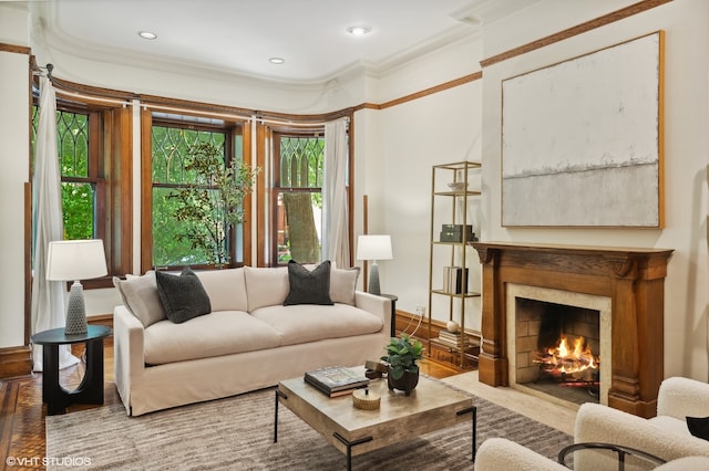 living room featuring wood-type flooring and ornamental molding