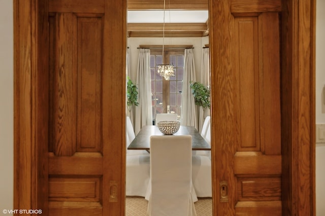 dining space featuring a notable chandelier